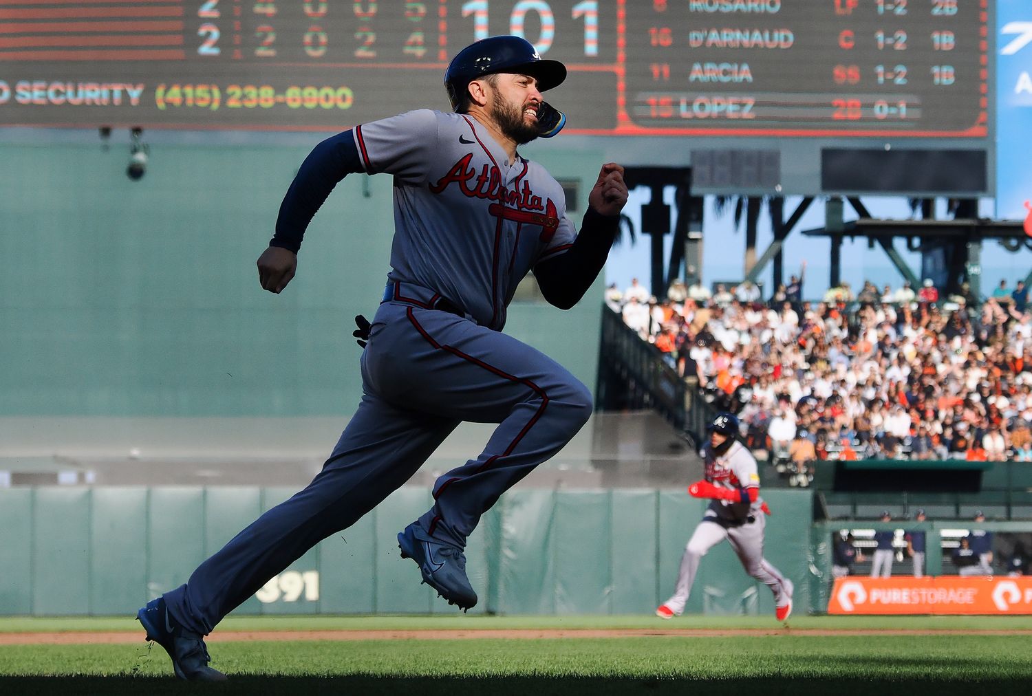 Aug 27, 2023; San Francisco, California, USA; Atlanta Braves catcher Travis d'Arnaud (16) runs home against the San Francisco Giants during the fifth inning at Oracle Park.